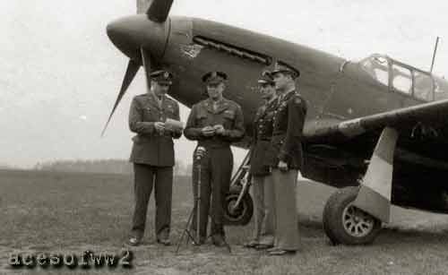 Brig. Gen. Jesse Auton, Gen. Eisenhower, Capt. Gentile & Col. Blakeslee await the start of the ceremony